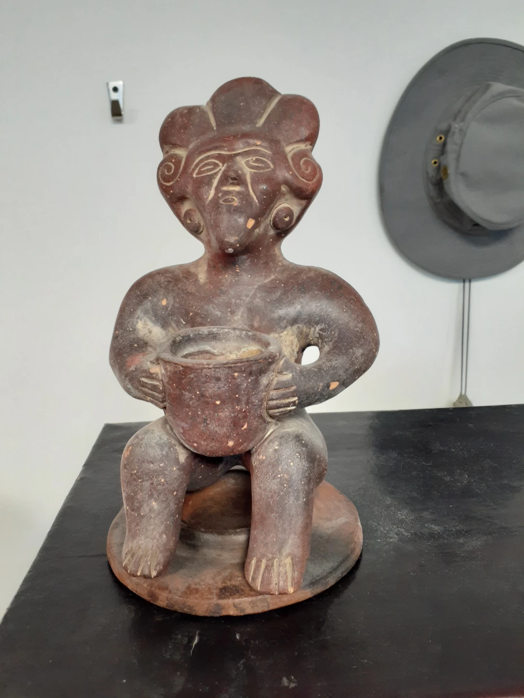 Terracotta Figurine Holding a Pot