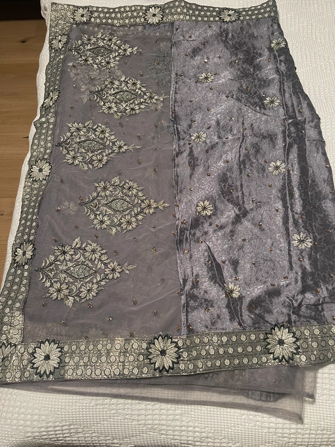 Grey and silver saree in satin and net , beautiful silver work .