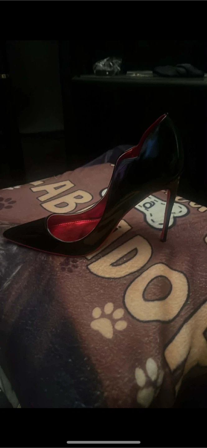 Black heels that happen to have red on the bottom