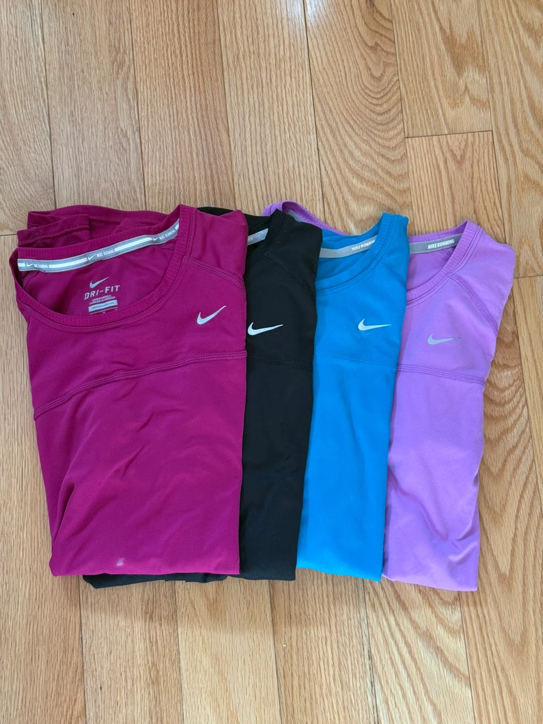 Four Women’s Nike Dri-FIT Running T-Shirts
