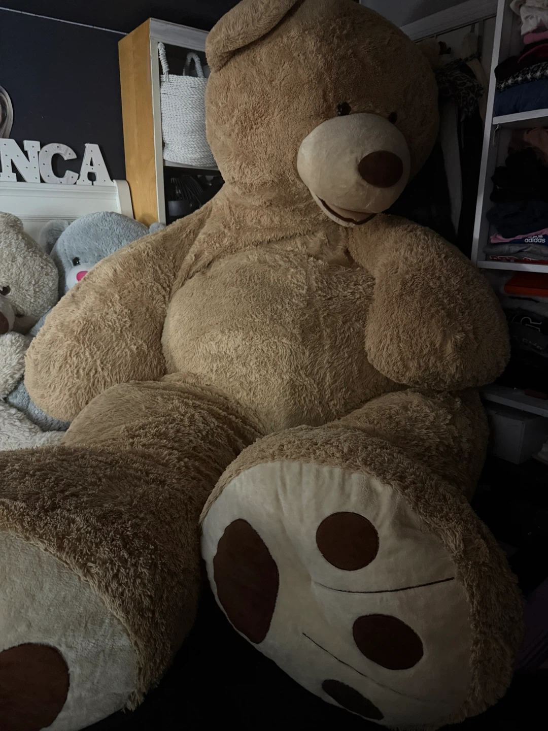 A charming and fluffy 9 -ft-tall bear.