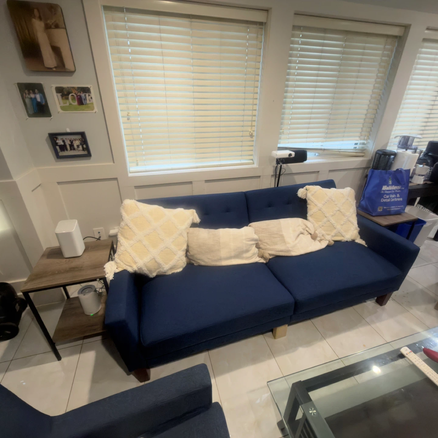 Blue Sofa, Glass Coffee Table and blue armchair