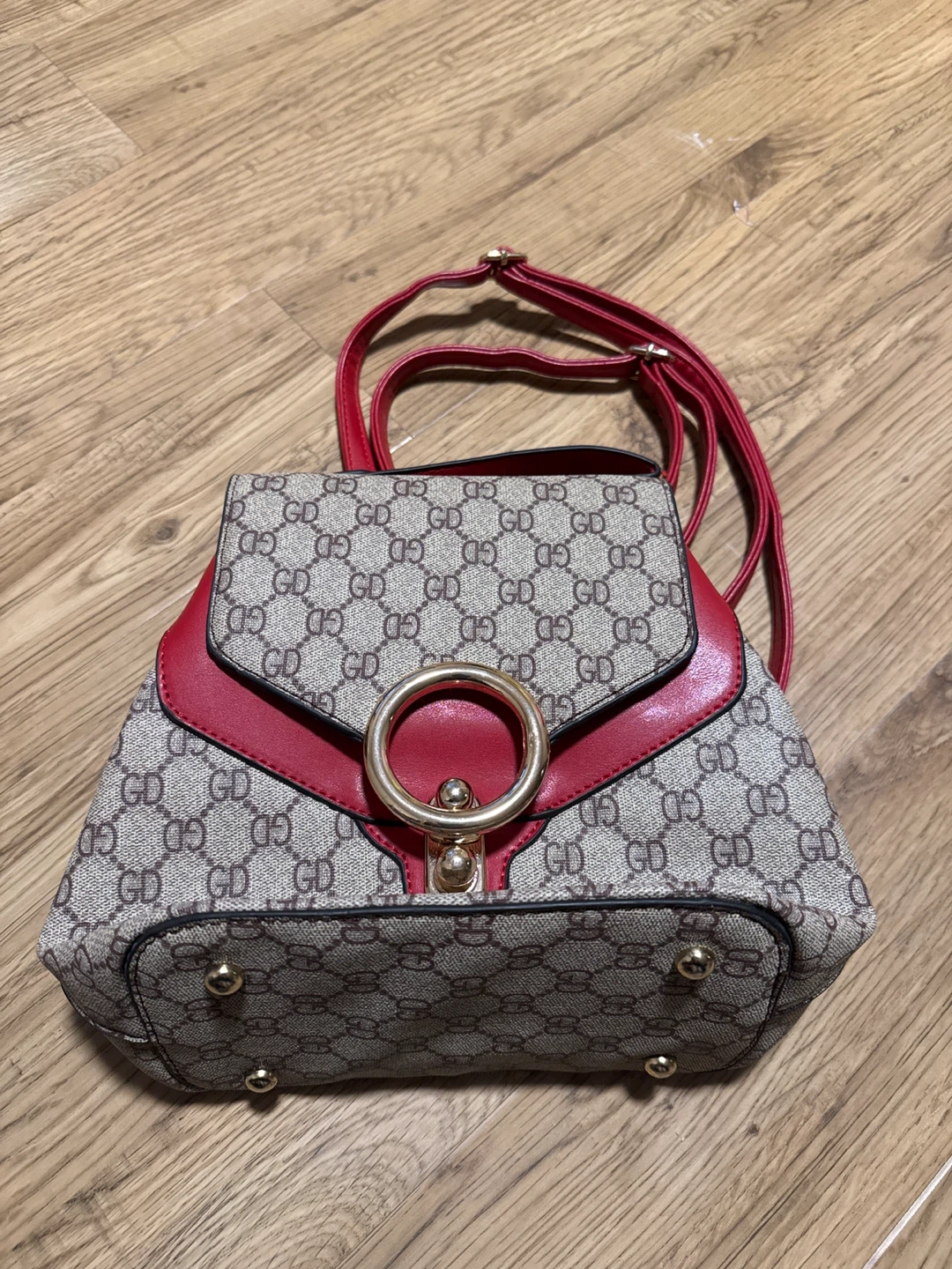GD patterned backpack, red accents