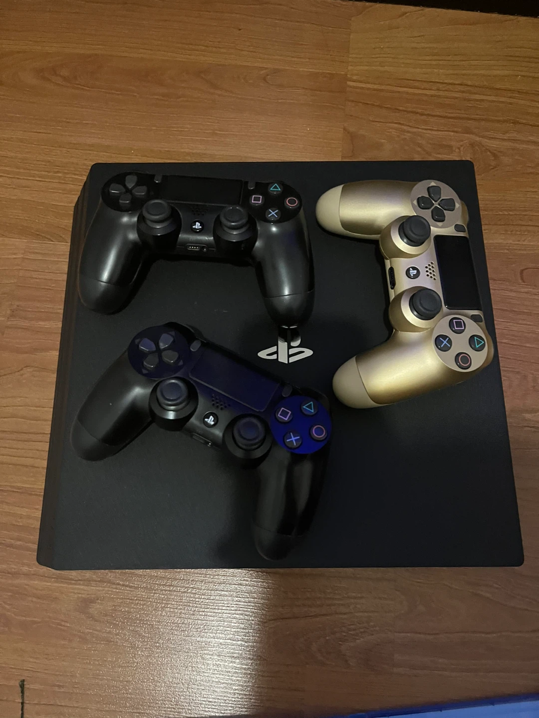 PlayStation 4 Pro Console with Games and Controllers