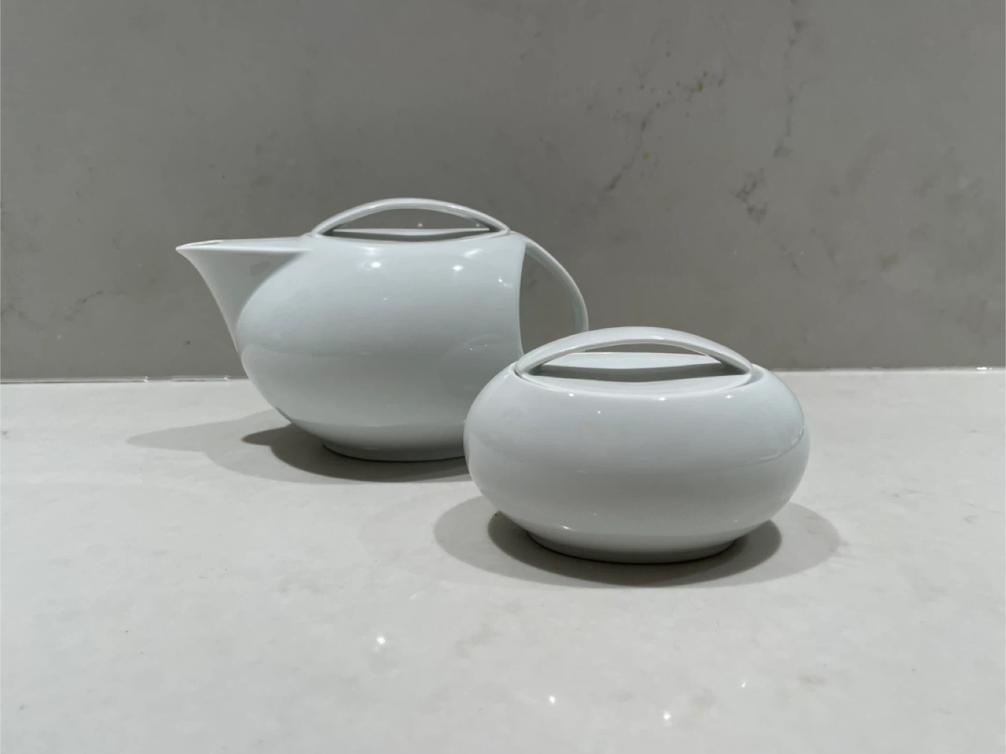White porcelain teapot and sugar bowl