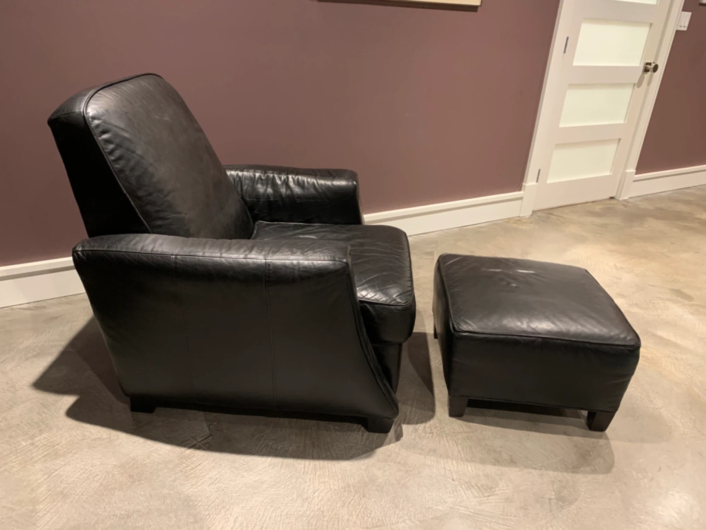 Black Leather Armchair and Ottoman Set