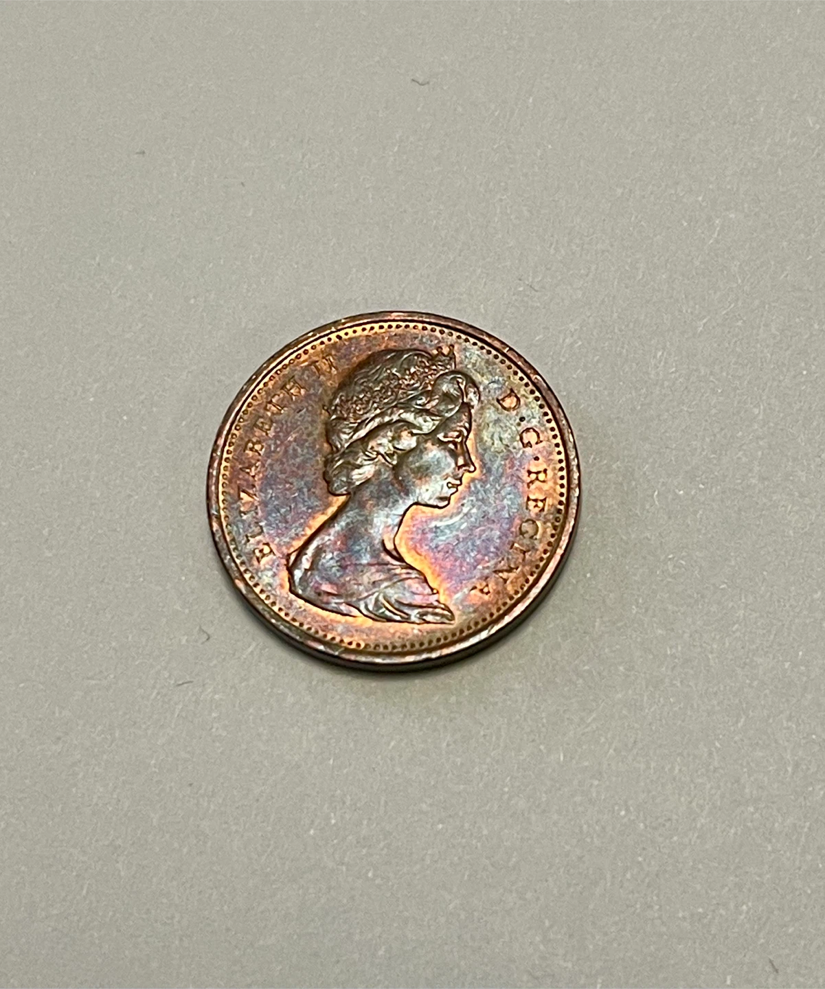 Rainbow toned 1 cent coin