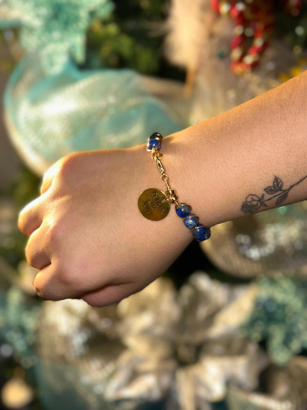 Blue beaded bracelet with gold charm