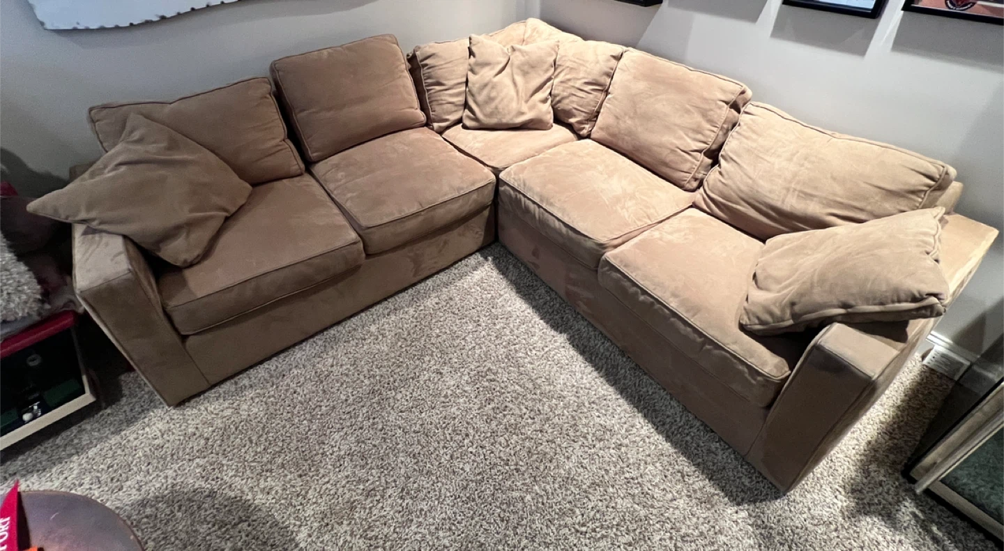 Beige Sectional Sofa with Pillows
