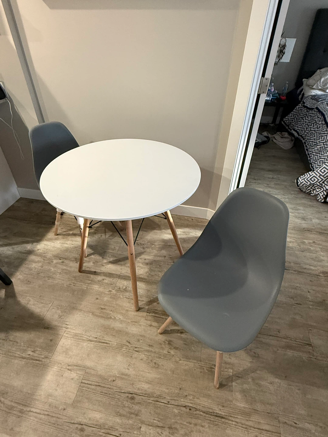 Round White Dining Table with Four Grey Chairs - photo 2
