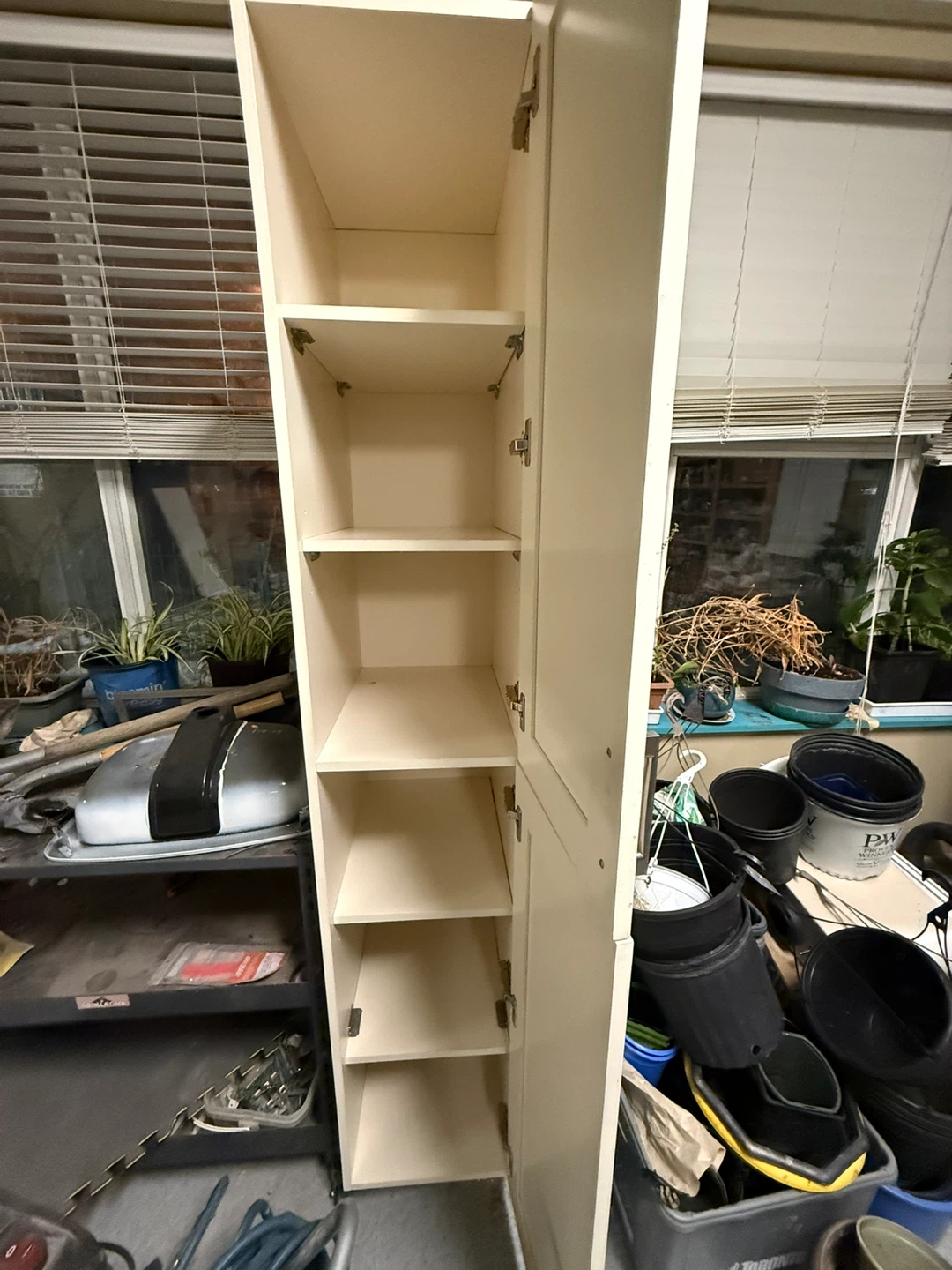 Tall white storage cabinet - photo 3
