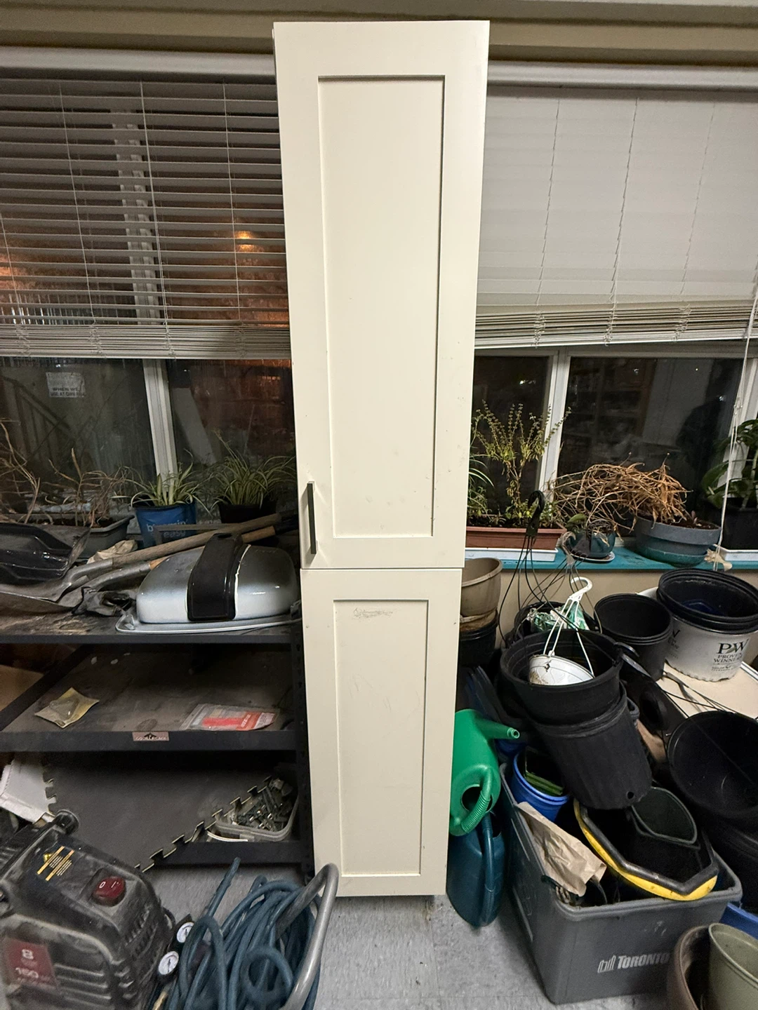 Tall white storage cabinet
