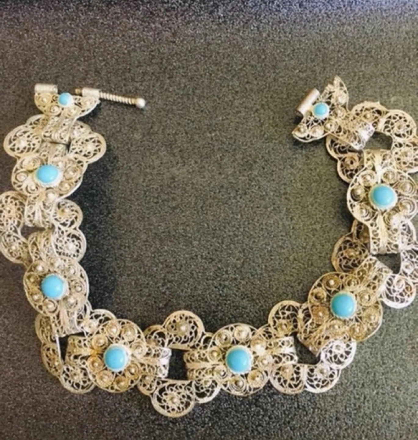 Sterling Silver Filigree Bracelet w blue stones: $800 online