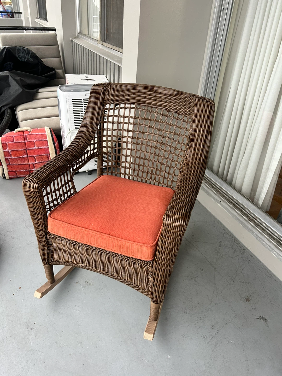 Wicker Rocking Chair with Orange Cushion