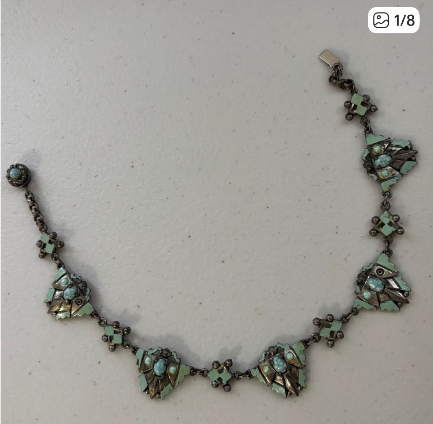 This is a vintage Zuni turquoise squash blosso