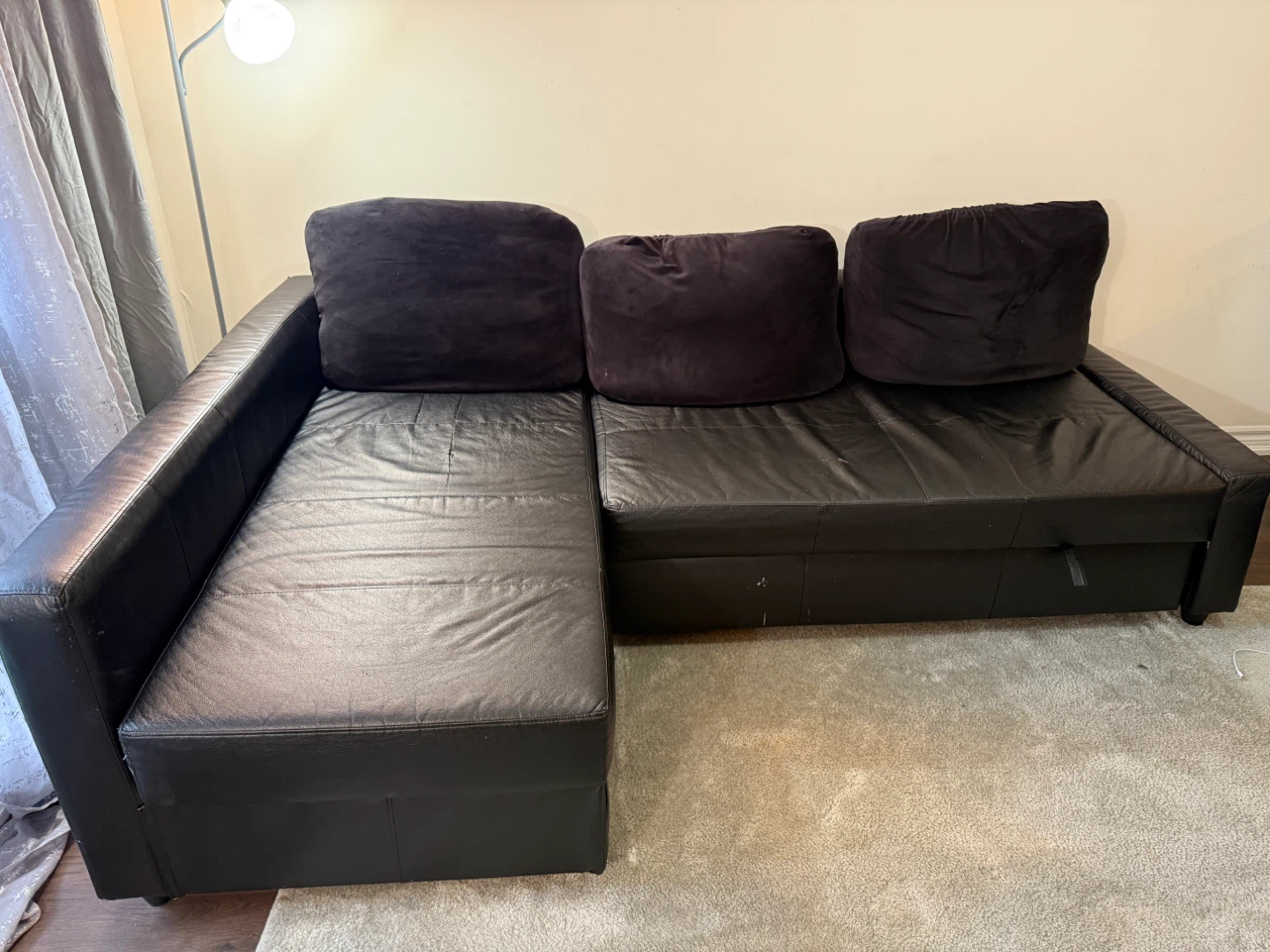 Black Leather Sectional Sofa with Pull-Out Bed