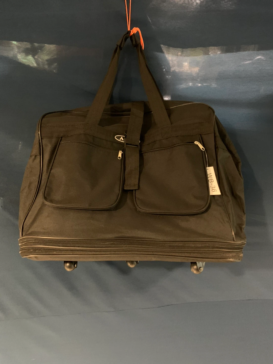 ALTA Black Rolling Duffel Bag