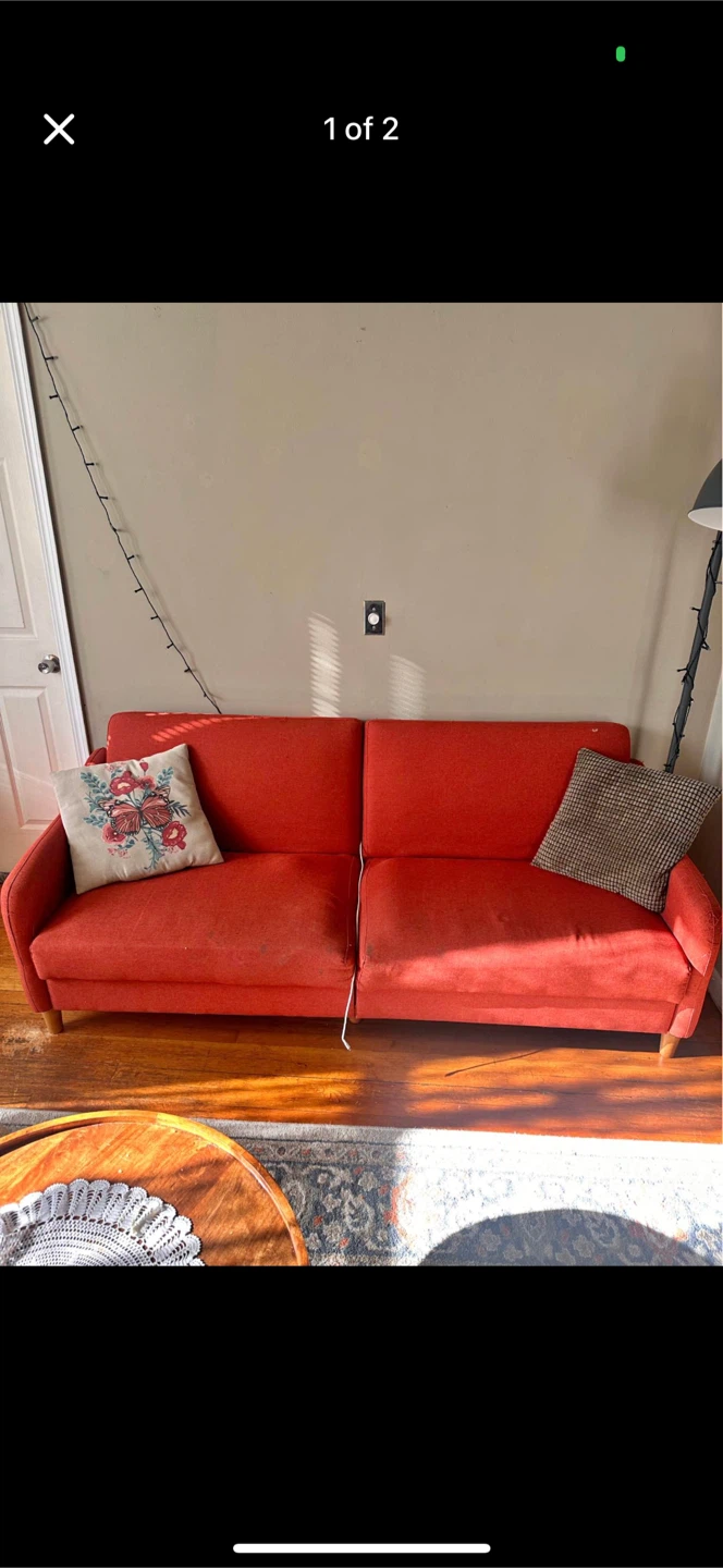 Orange/red futon no throw pillows. Easy garage pick up