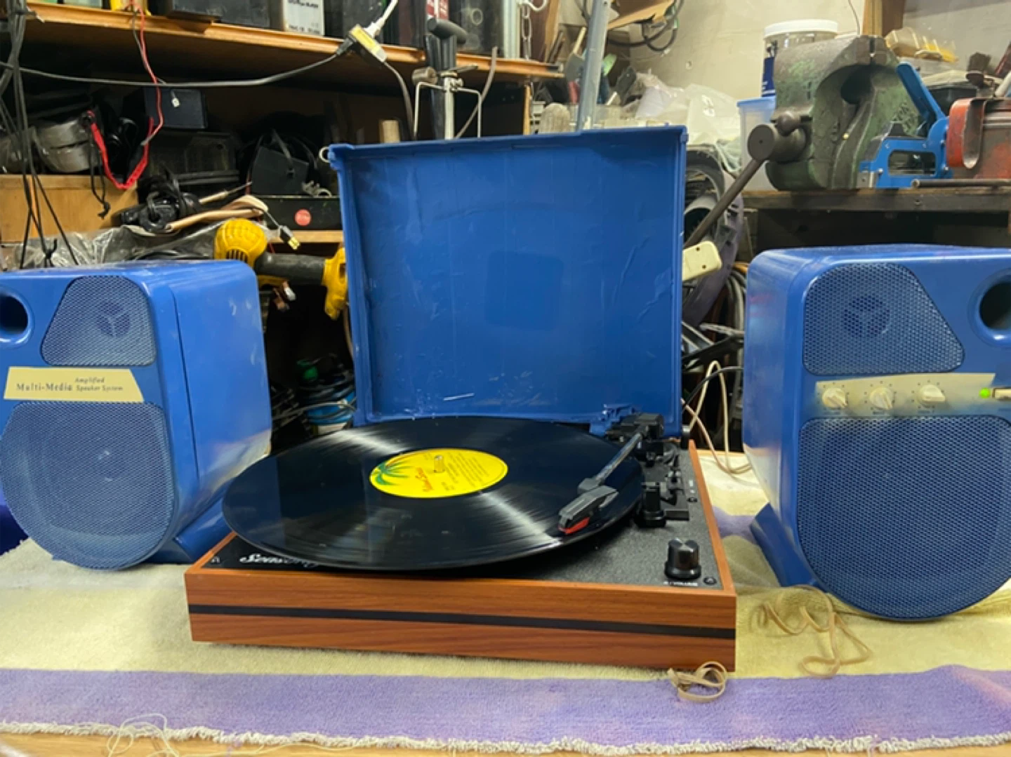 Turntable with powered multi media speakers