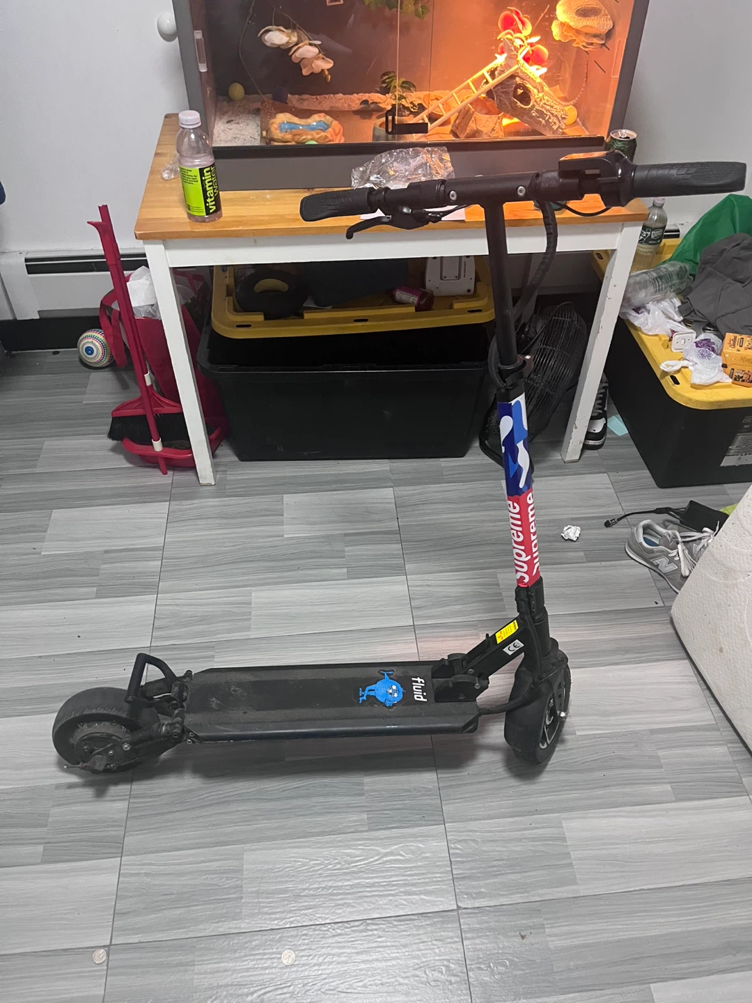 Fluid E Scooter with Supreme Sticker