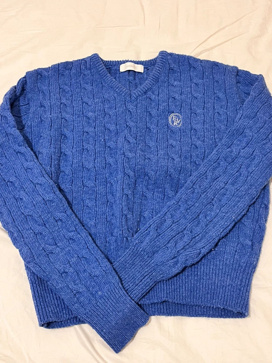 blue cable knit sweater