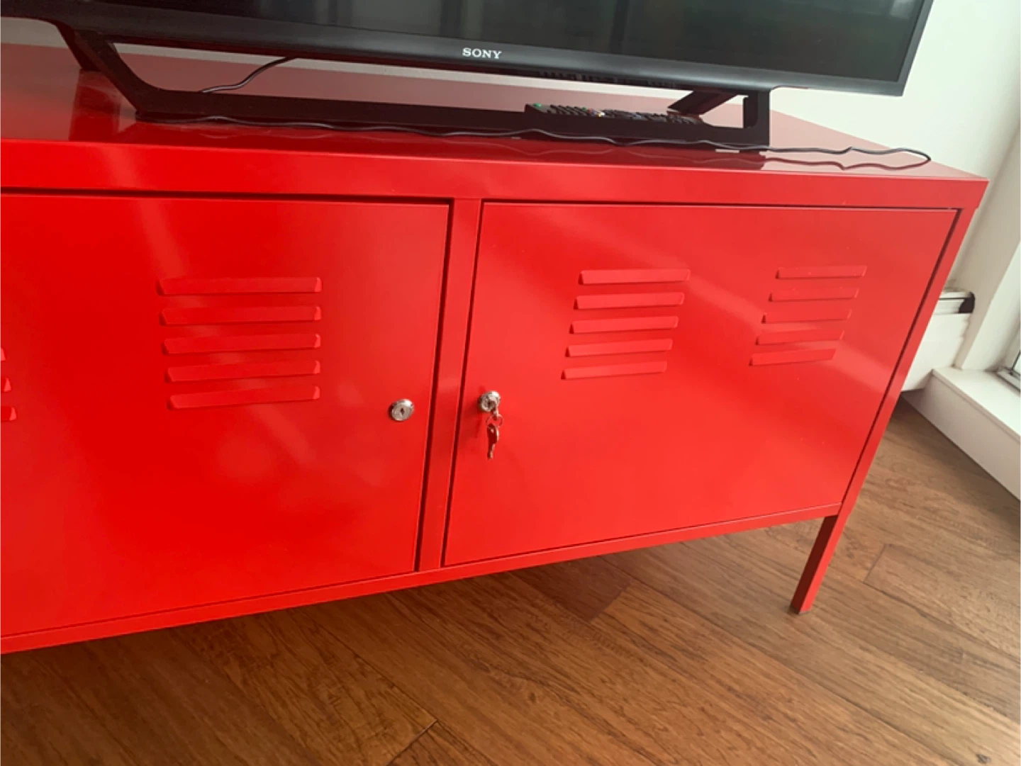 Red Metal TV Stand with Doors