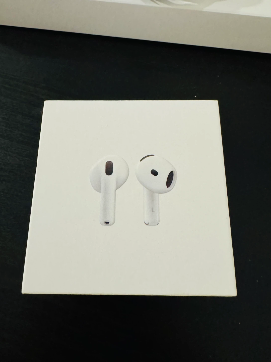 Apple AirPods 4 boxes