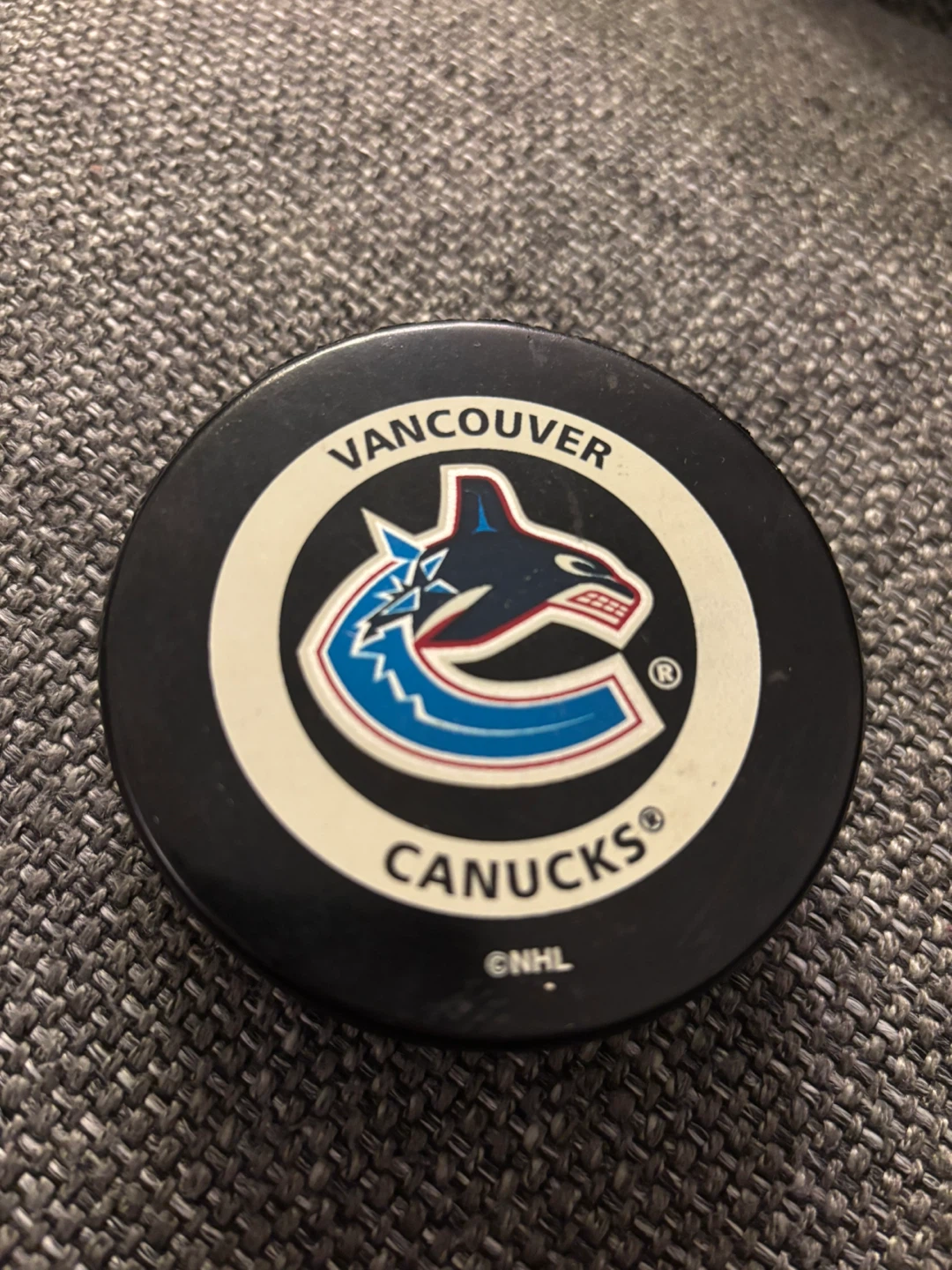 Official Canucks game puck (early 2000s)