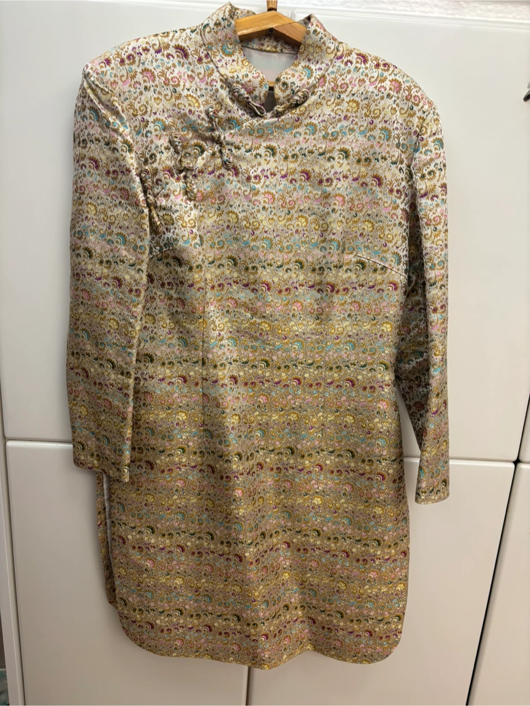 Brocade Chinese-style tunic with black pants