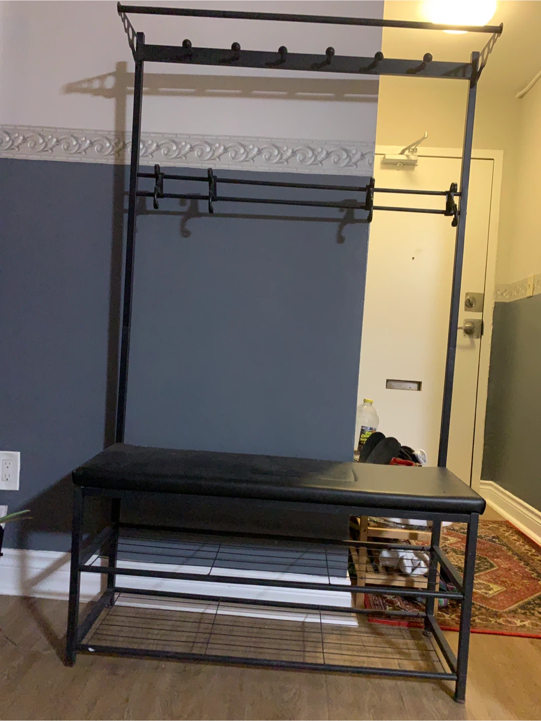 Large shoe rack with hanging knobs and sitting bench