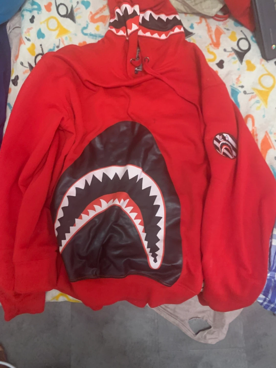 Red BAPE Shark Hoodie and a Denim tears