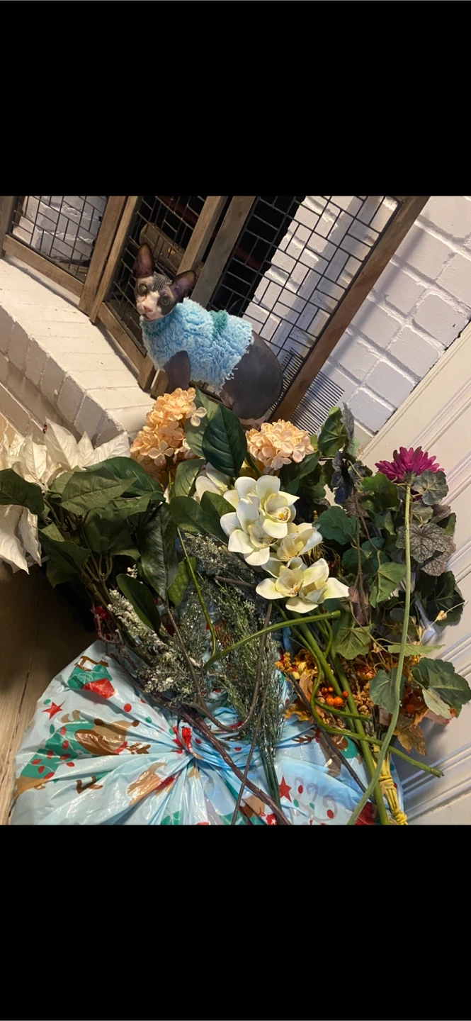 Different faux flower arrangements & exterior pole flags