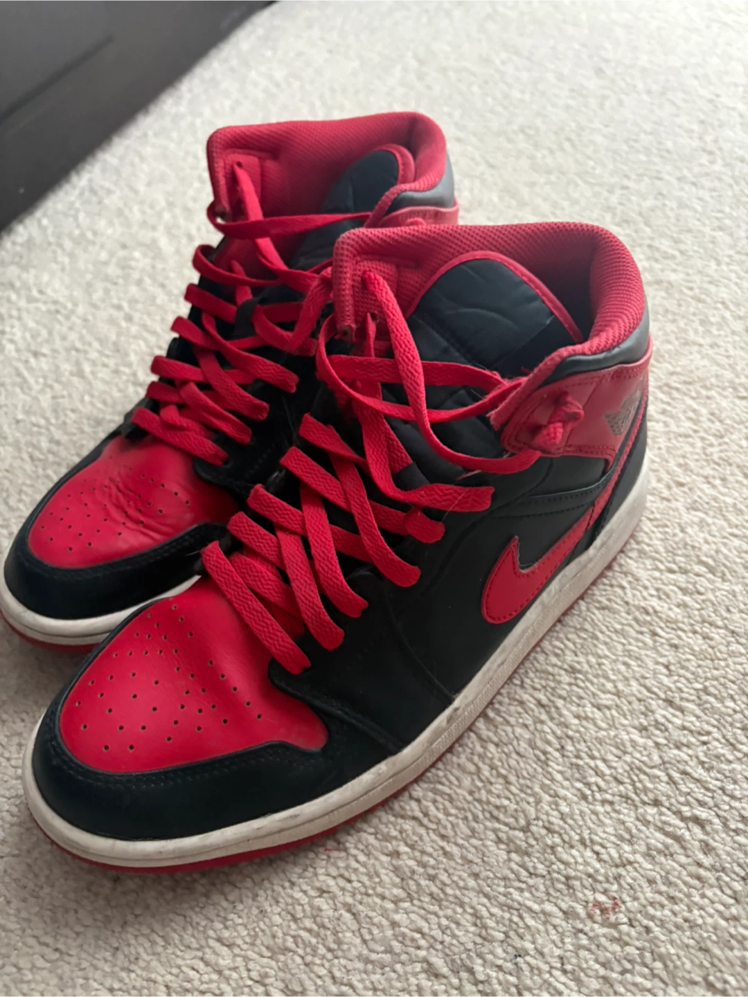 Red and black Nike Jordan 1