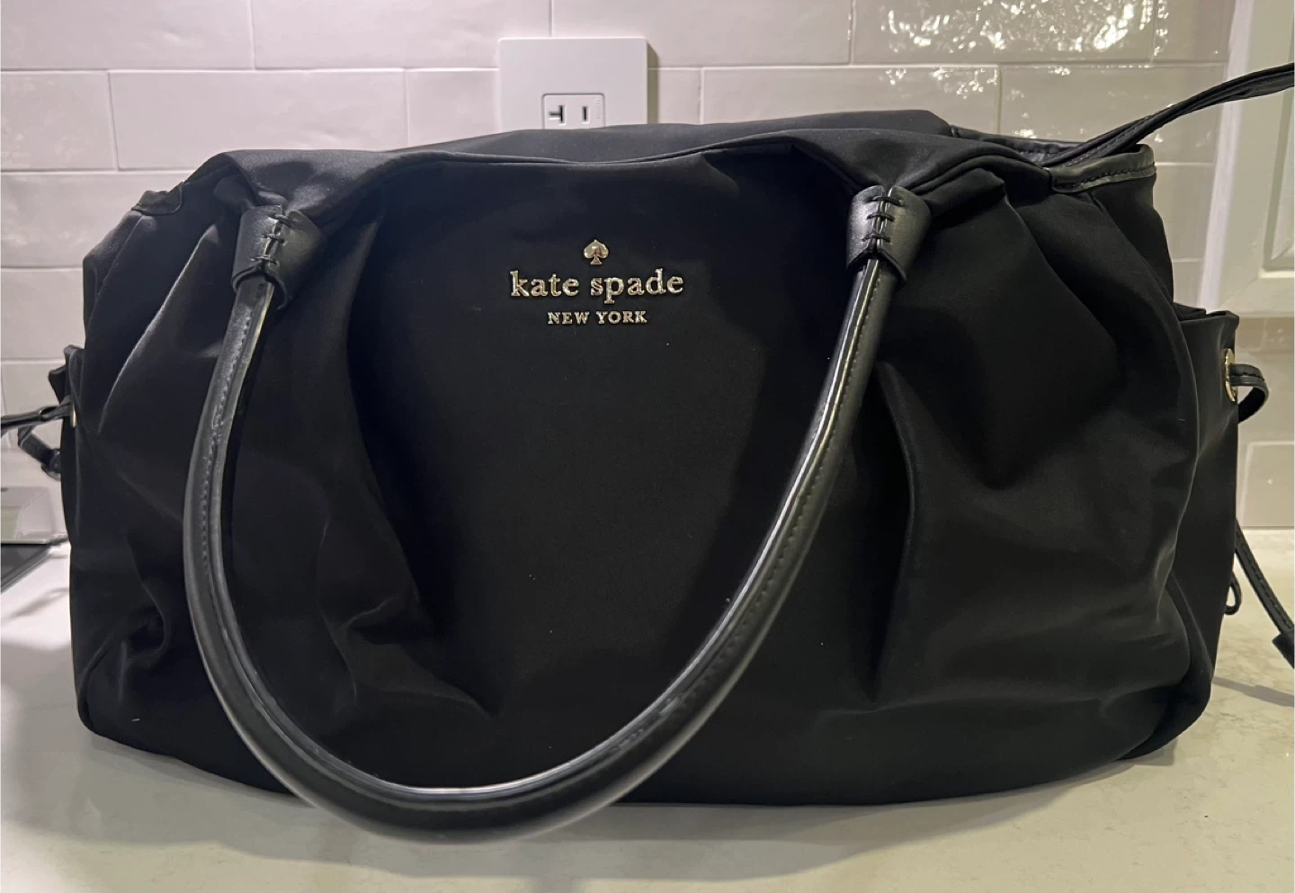 Kate Spade Black Diaper Bag w pad + matching pacifier holder