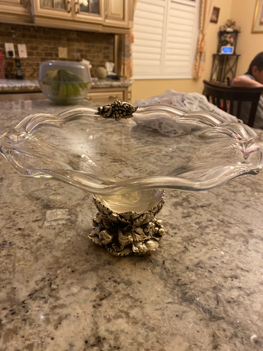 Glass footed serving bowl with ornate base