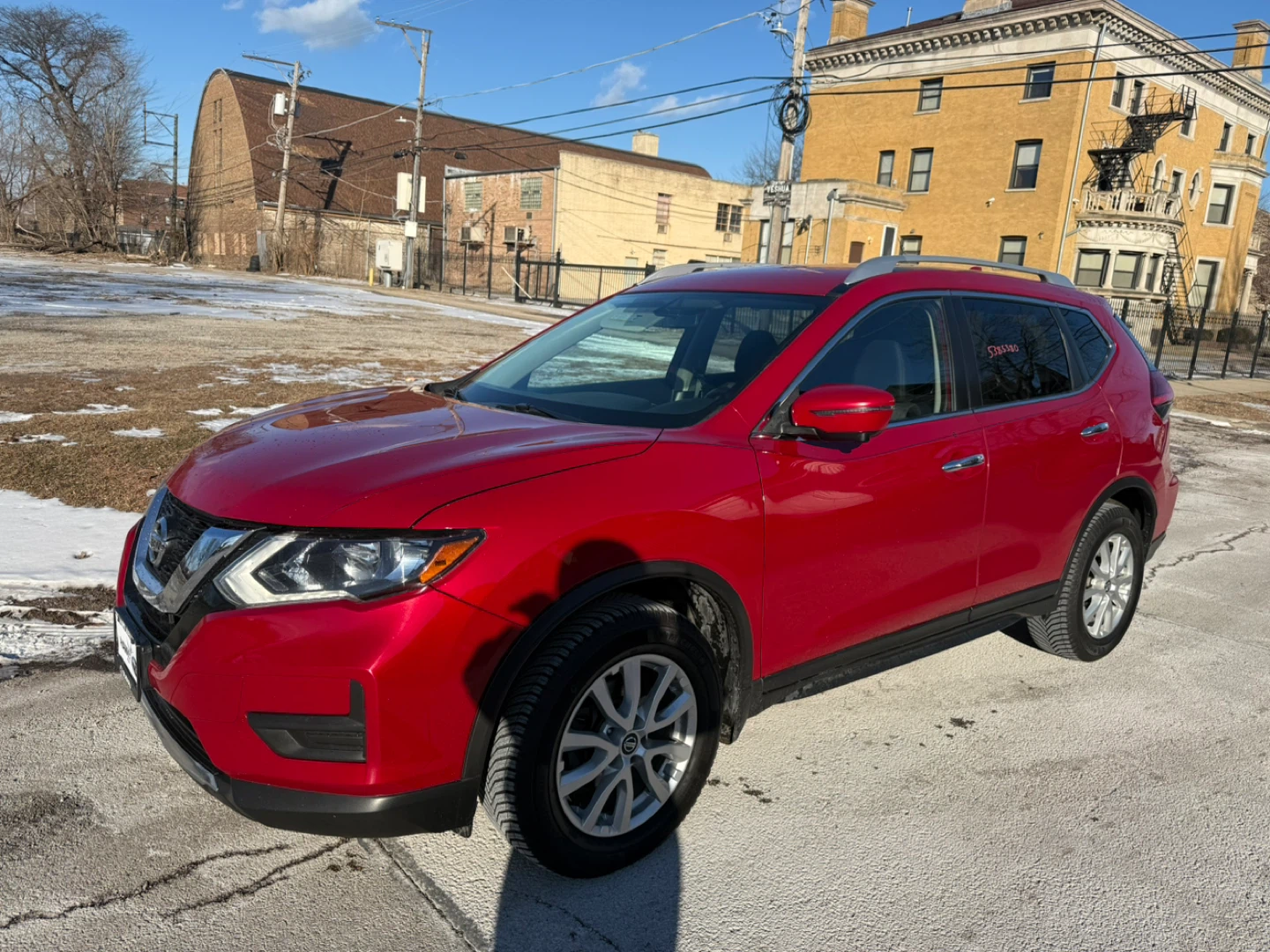Red Nissan Rogue SV AWD SUV
