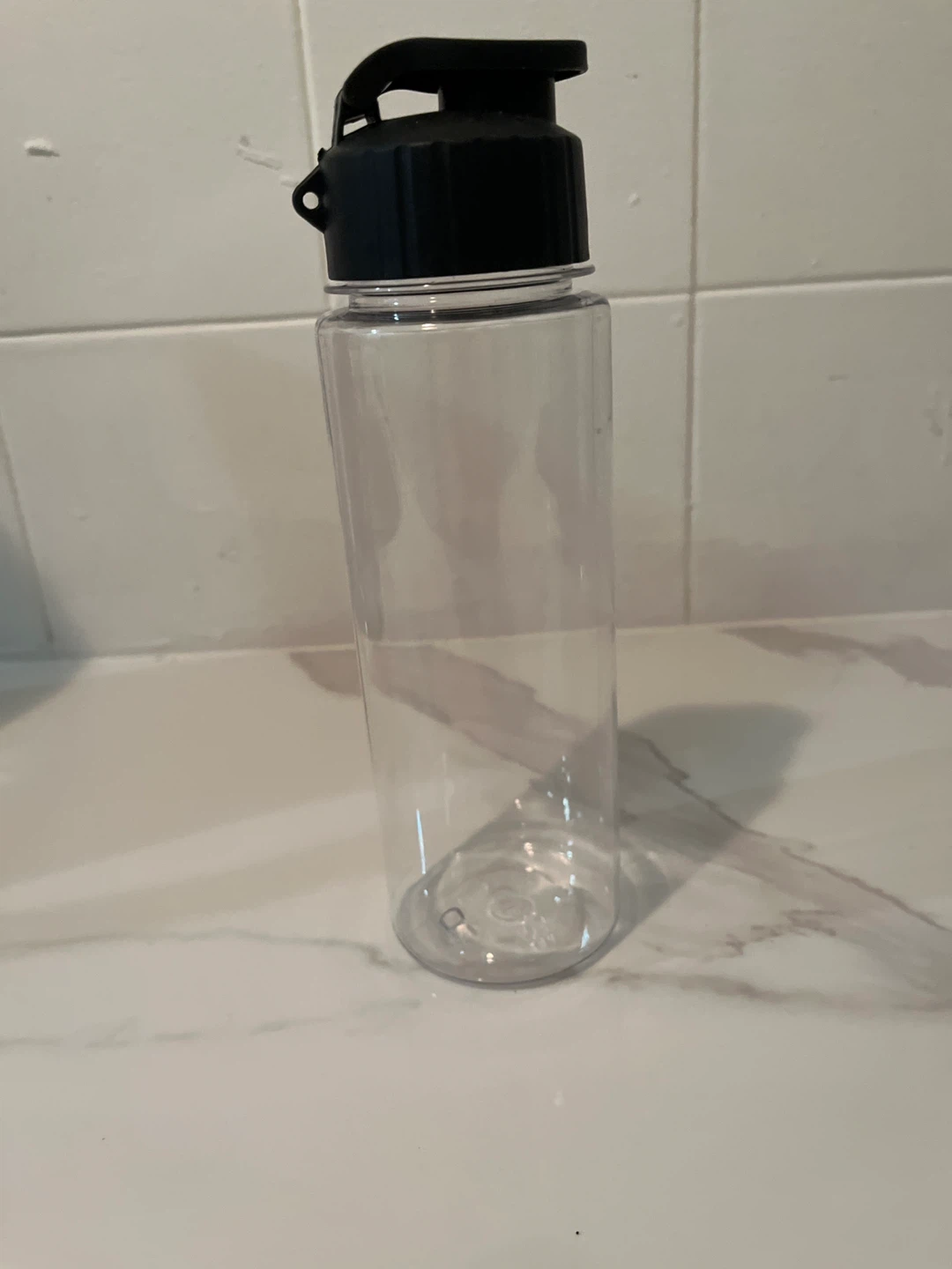 Clear Plastic Water Bottle with Black Flip-Top Lid