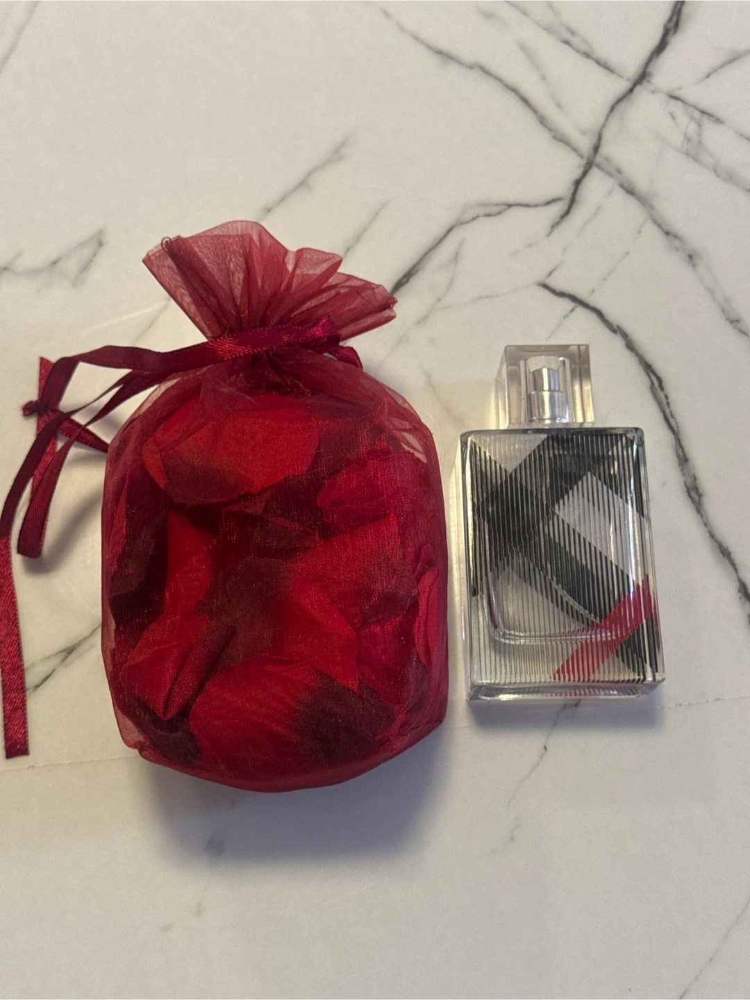 Empty Burberry Brit Spray Bottle and Sachet of Red Rose Petals