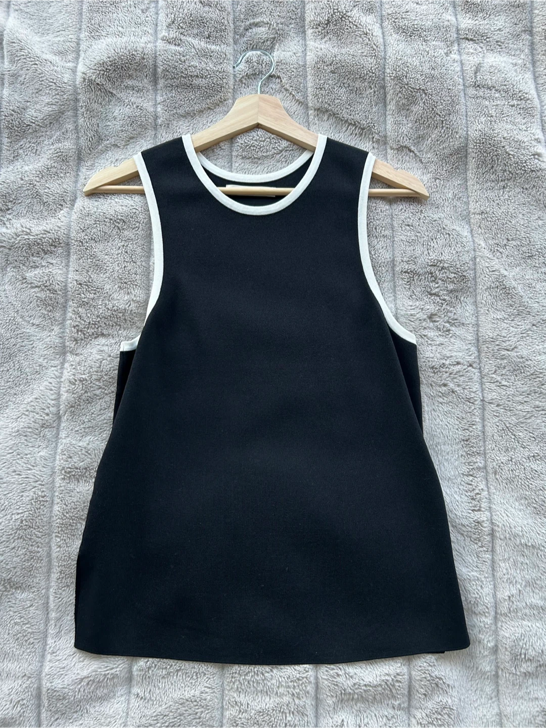 Black Sleeveless Top with White Trim
