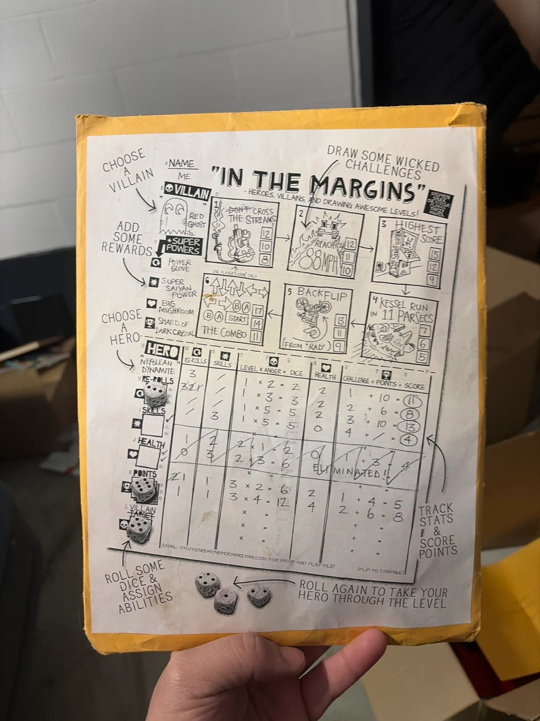 Indie board/dice game. "In the Margins"
