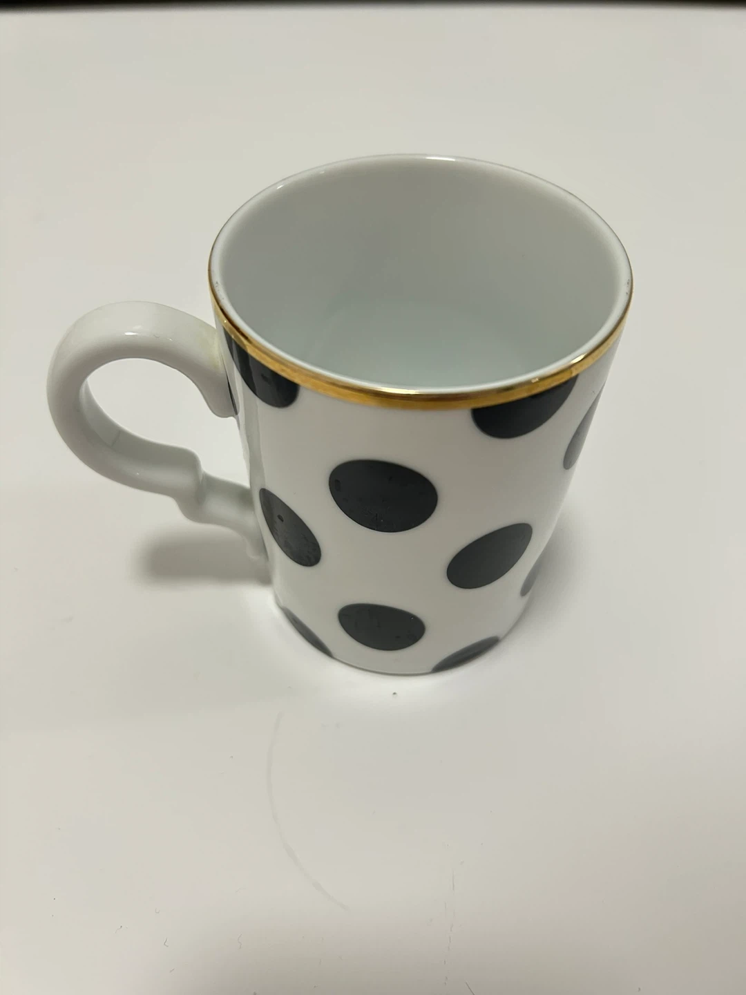 Preowned White Coffee Mug with Black Polka Dots and Gold Rim