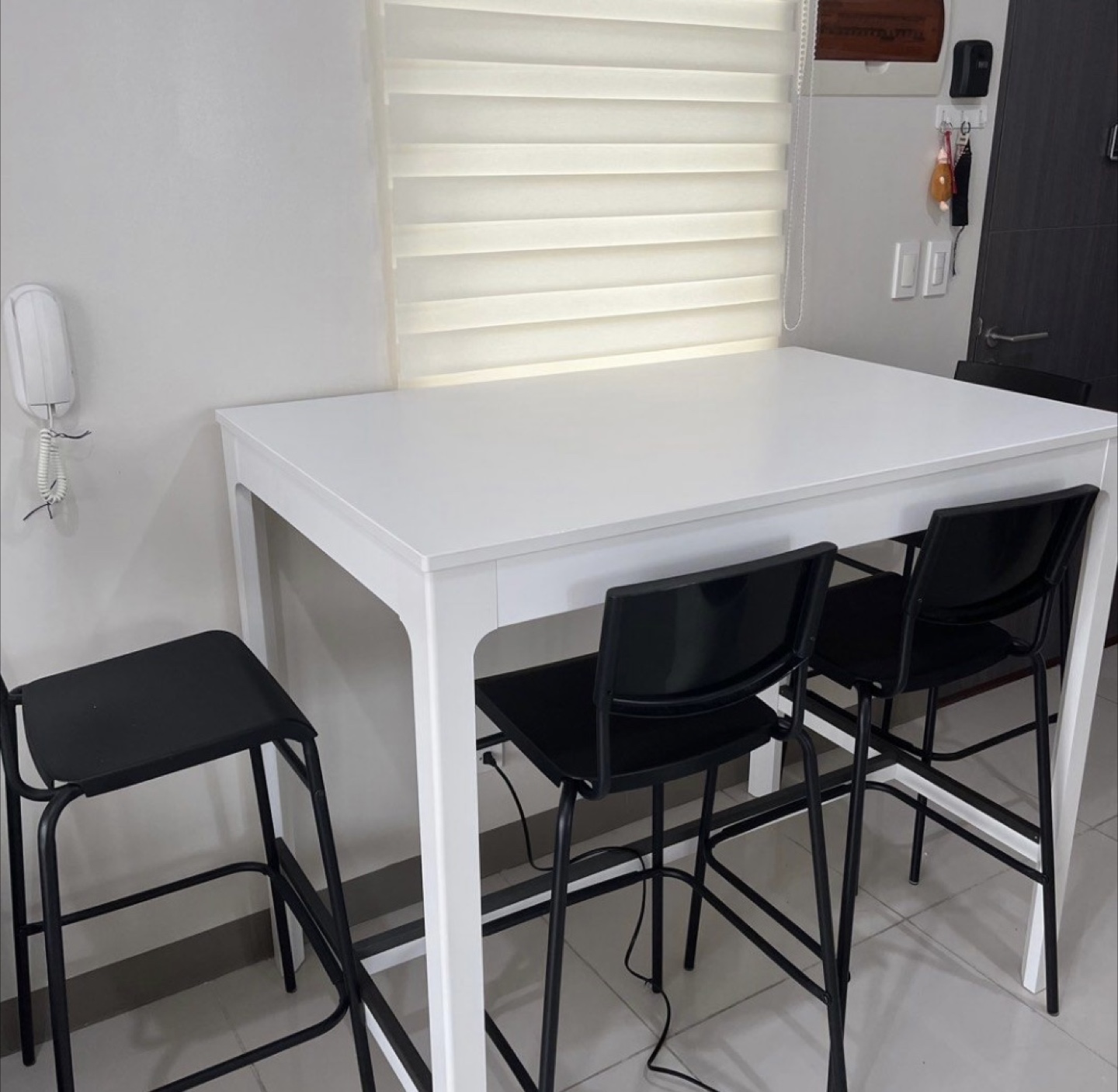 Can deliver—White bar table and 5 black bar chairs.