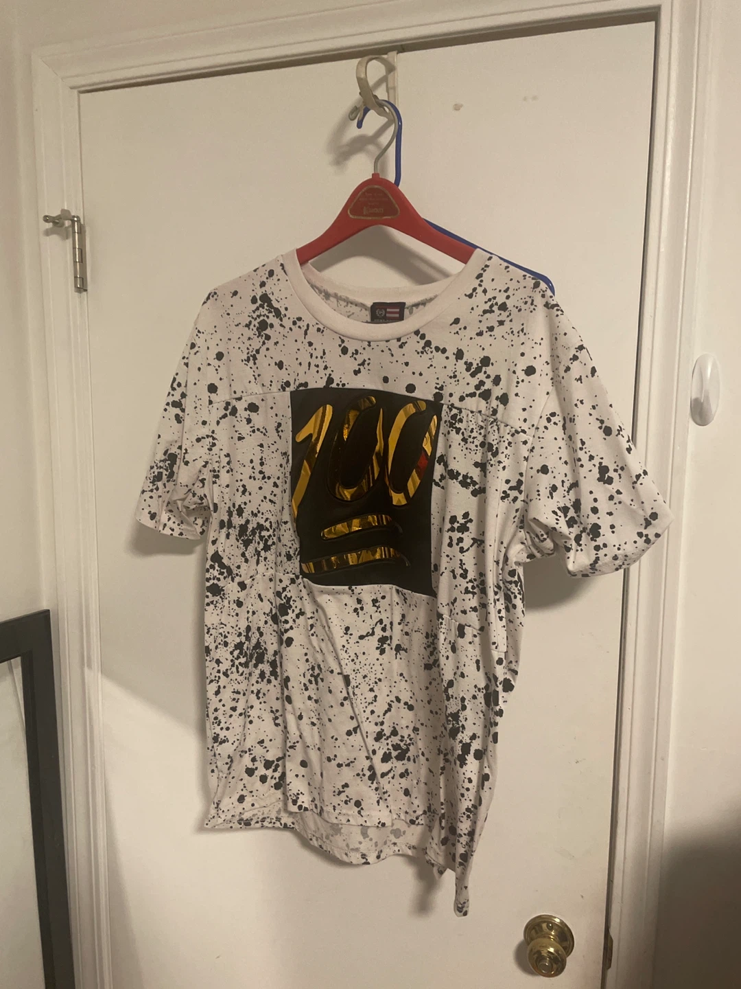 White T-Shirt with Black Splatter and "100" Graphic