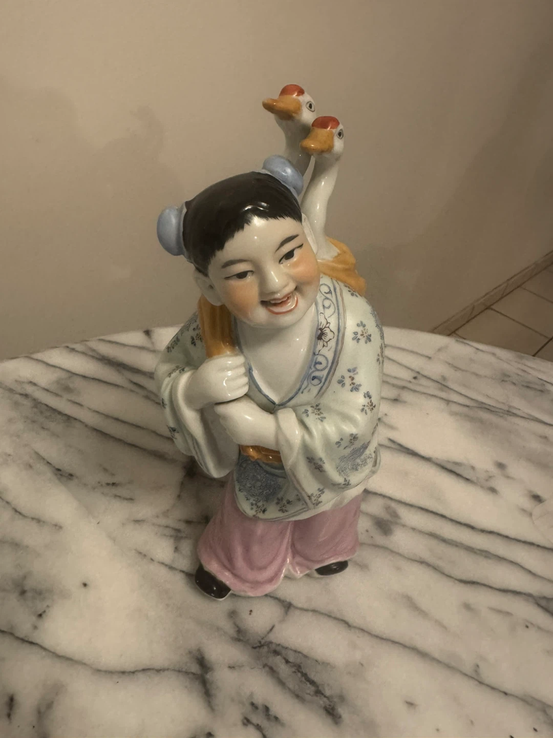 Ceramic Figurine of Child Carrying Geese
