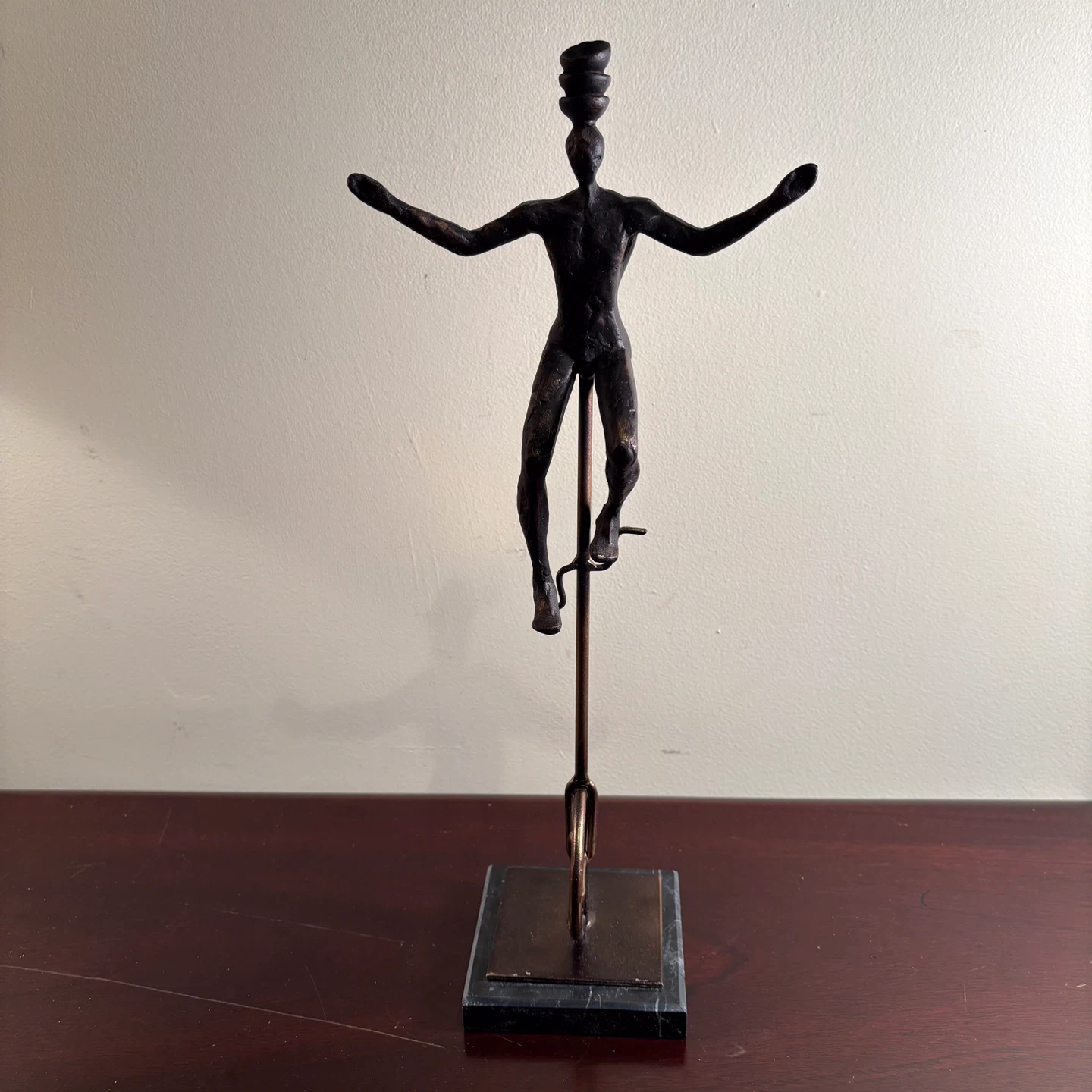 Bronze Finish Figurine of a Unicyclist Balancing Bowls