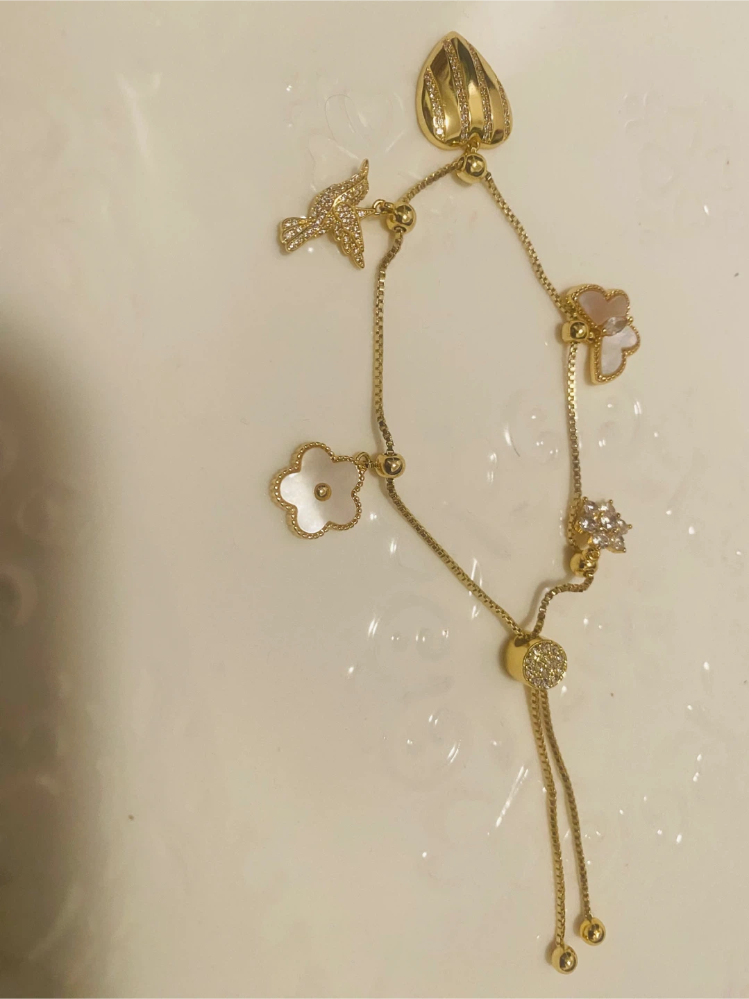 New / unused Gold color Necklace with Charms