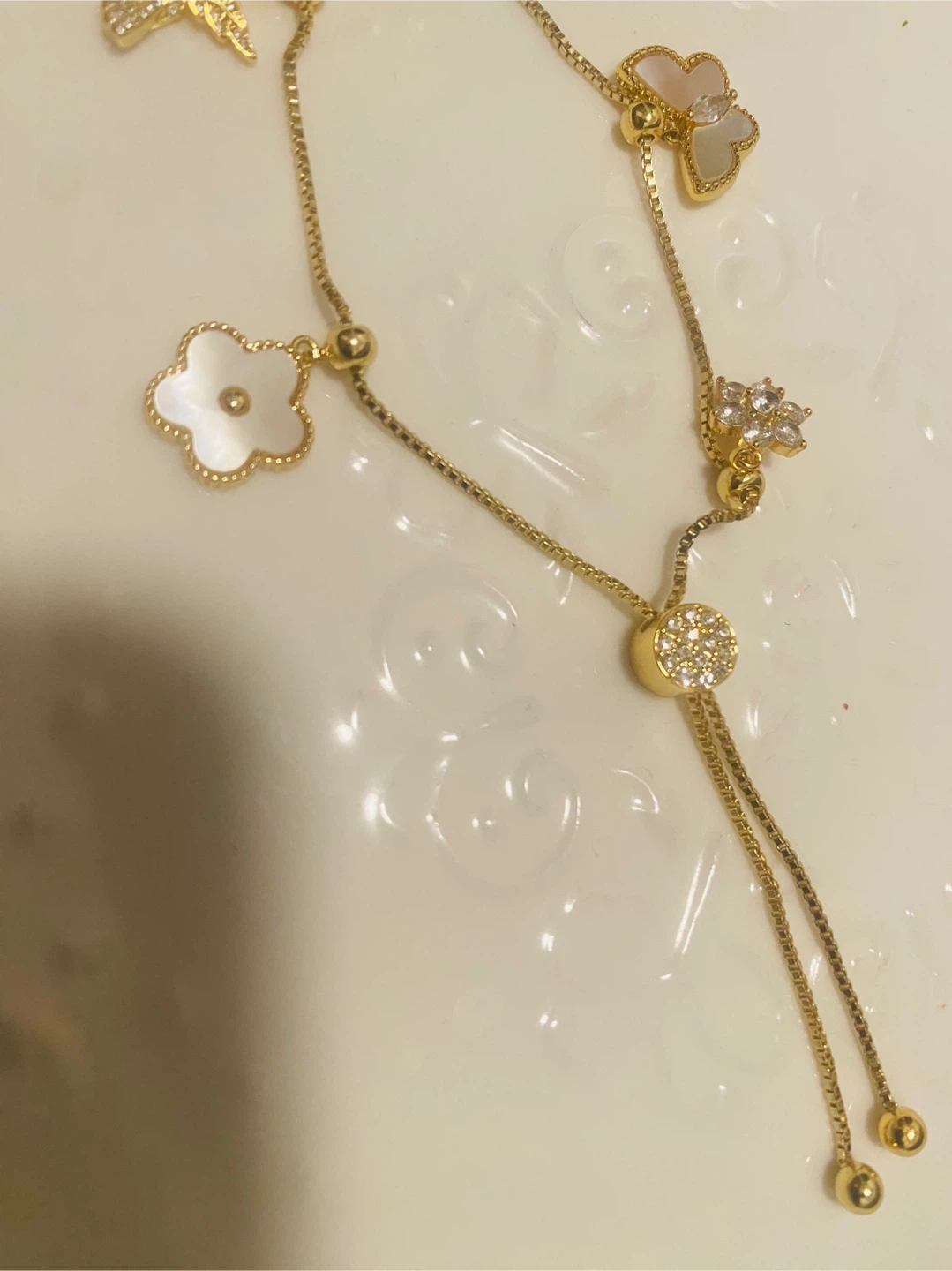 New / unused Gold color Necklace with Charms - photo 2