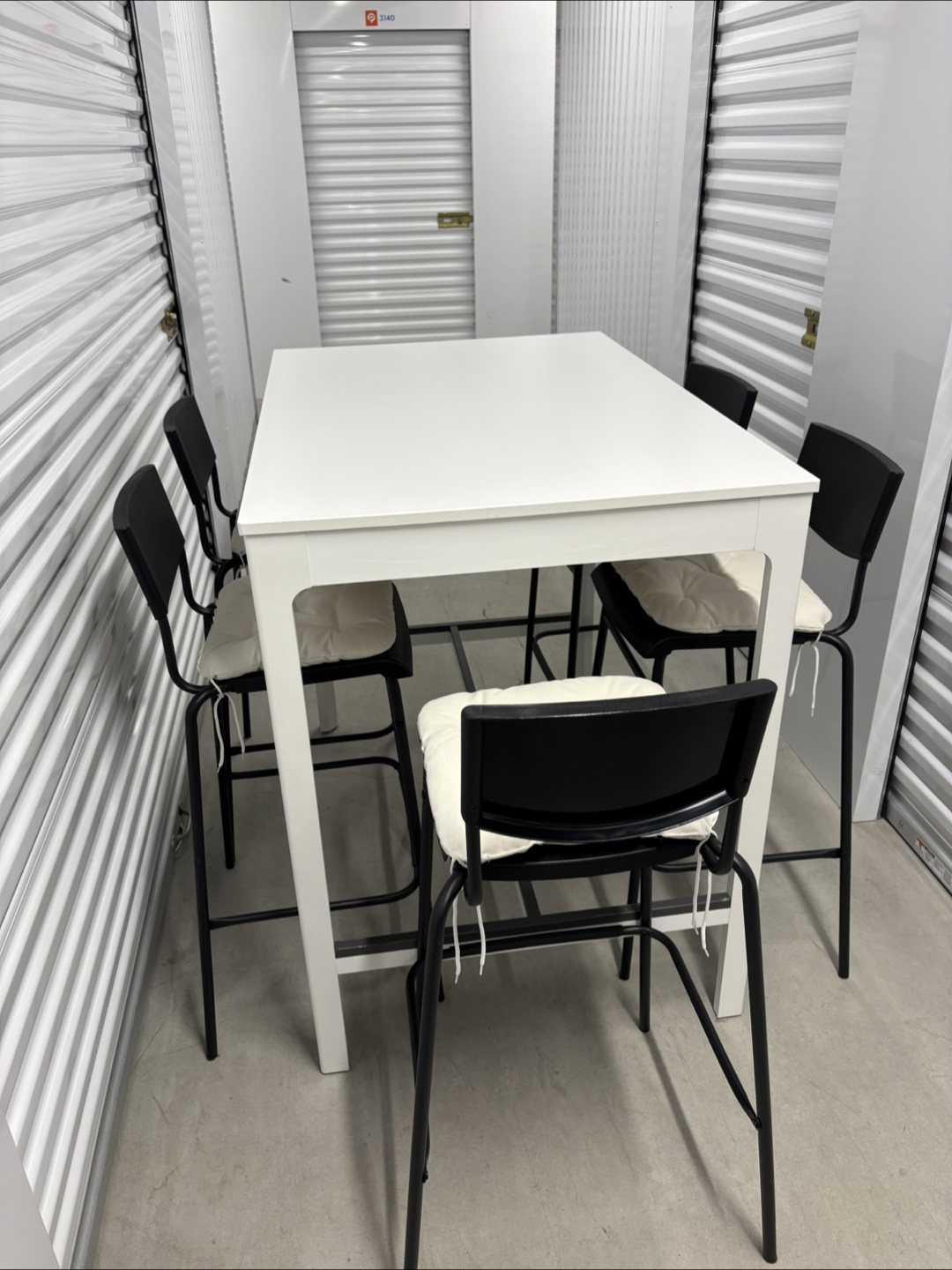 Can deliver—White bar table and 5 black bar chairs. - photo 5