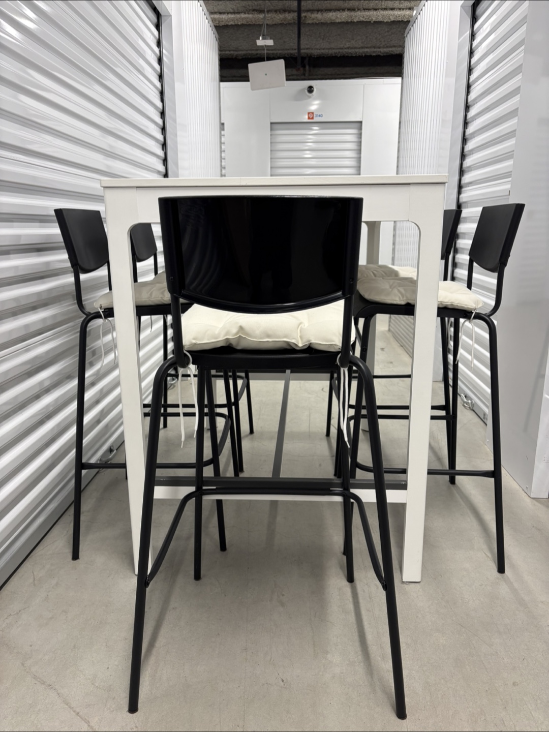 Can deliver—White bar table and 5 black bar chairs. - photo 2
