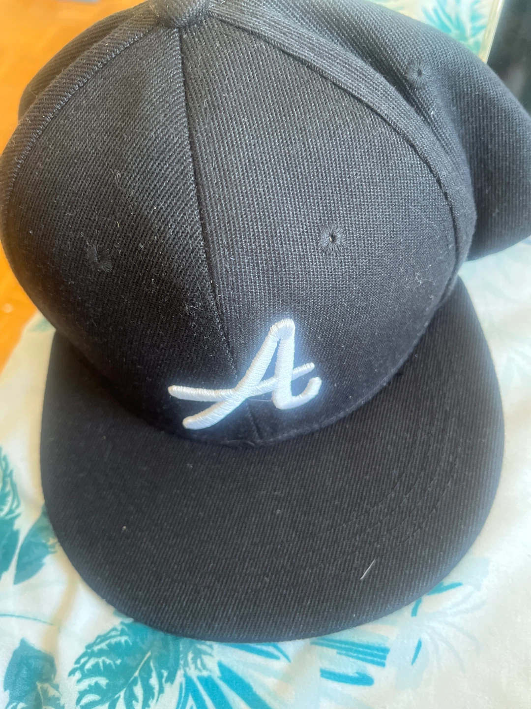Black Baseball Cap with 'A' Logo
